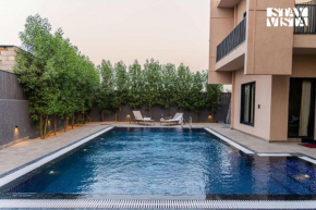 StayVista at Urban Escape - 2 Pools, Lawn & WiFi